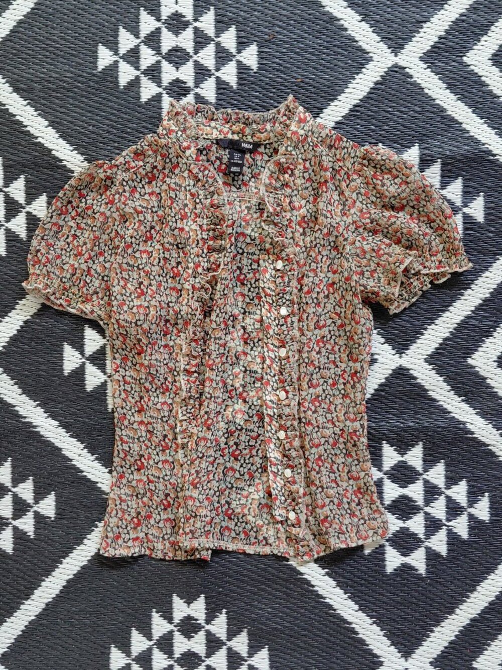H&M floral blouse with delicate ruffle trim